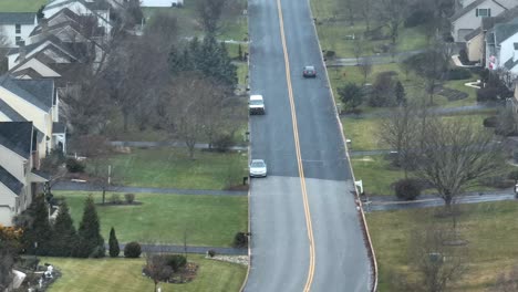 aerial shot of snow falling in a suburban usa town