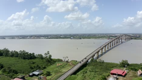 drone view of jules wijdenbosch bridge captured with mavic 2 pro, orbiting around bridge, suriname river in port of paramaribo, capital of suriname