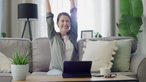 woman celebrating success at home