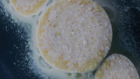 frozen potato dumplings frying