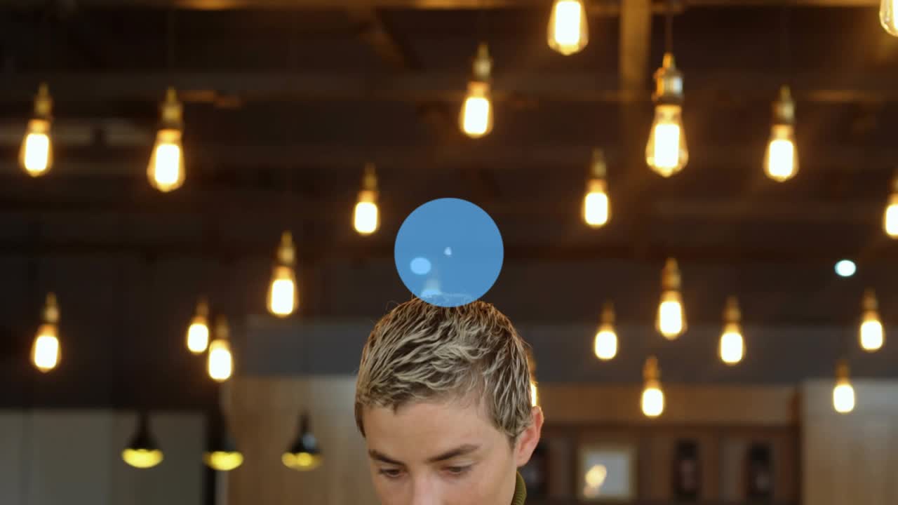 Woman at cafe glancing laptop as icon appearing network grouping expanding tapping phone linking IT