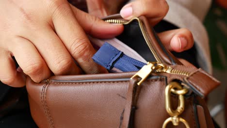 woman opening a purse