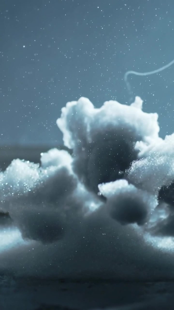 Vertical video: Growing cloud bank rising over sea as trail drifting right, stars shining