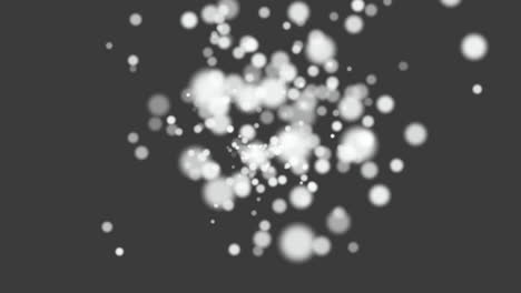 Fly-small-white-particles-and-round-bokeh-on-black-background