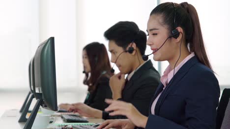 Business-people-wearing-headset-working-in-office