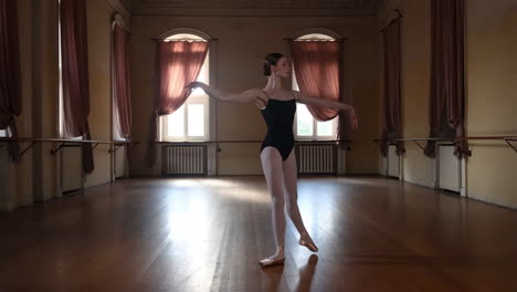 young ballerina practicing in a classical dance studio