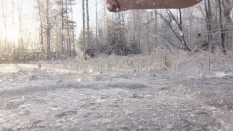 STUNNING-BACKLIT-240fps-axe-smashing-an-ice-bathing-hole