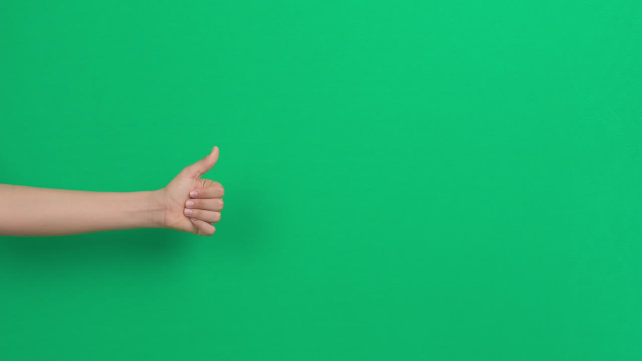 Like dislike gestures. Hand showing thumbs down, dislike or negative sign symbol and change to thumbs up, like, ok sign over green screen chroma key background
