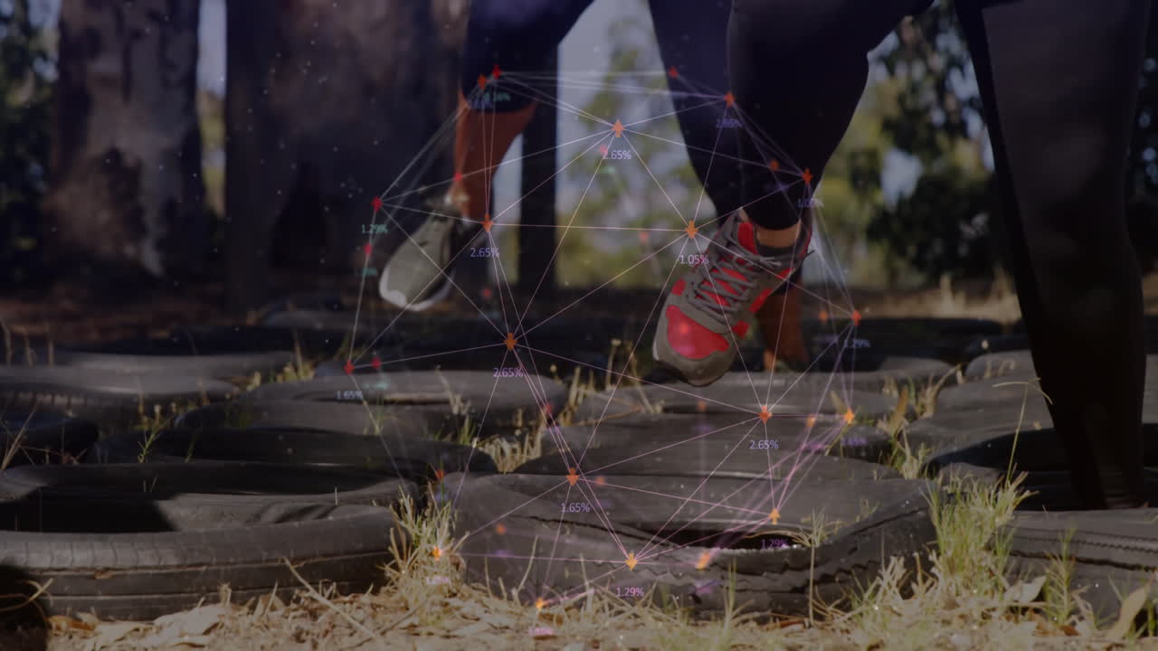 People running through tire obstacle with network connections animation overlay