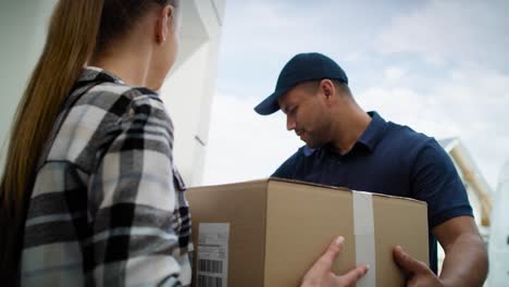 tracking video of courier delivers the package to the customer