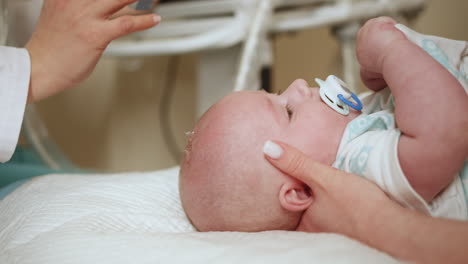 baby undergoing medical examination
