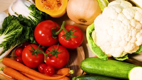 assorted vegetables displayed on a black background