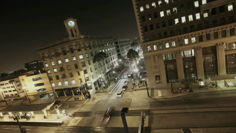 Traffic-drives-through-a-busy-intersection-at-night