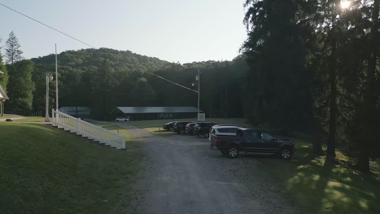 A serene countryside retreat nestled among lush, rolling hills. The perfect escape to reconnect with nature, breathe fresh air, and enjoy a peaceful, secluded getaway.