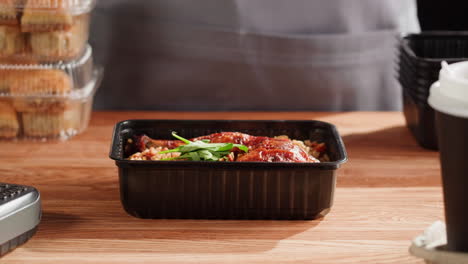 restaurant employee packaging food order