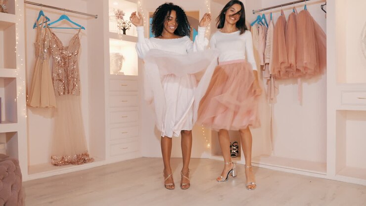 Two Women Dancing in a Stylish Closet