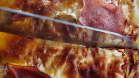 close-up of a pizza with ham and mushroom toppings