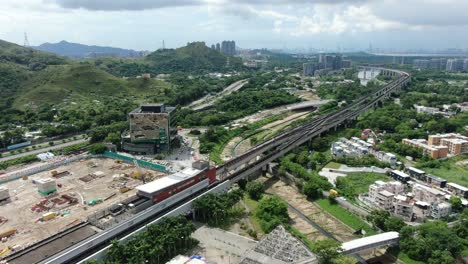 hong kong mtr railroad in the city outskirts, aerial view