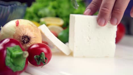 Man-Making-Salad-In-Kitchen-6