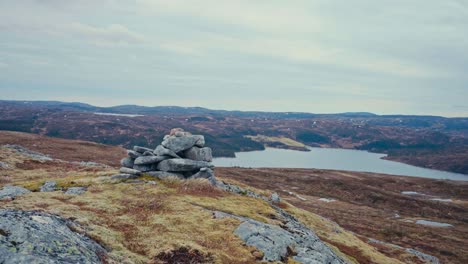 stone pile near reinsjoen lake in norway. handheld shot