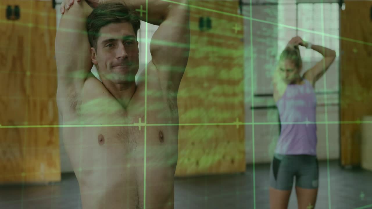 Gym duo starting overhead tricep stretch preparing workout, code overlay scrolling over subjects