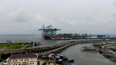 rising aerial of industrial container harbor tanjung priok, indonesia