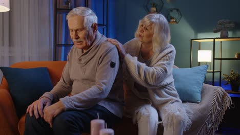 senior man sit with wife indoors feels upset potency health problems crisis impotence disease