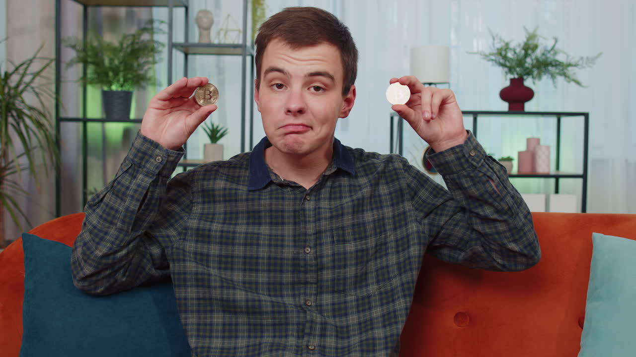 Man holding Bitcoin coins