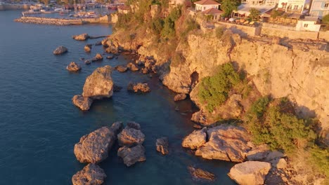 coastal cliffside view with harbor and buildings