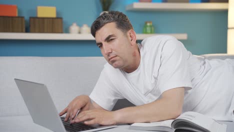 Man-using-laptop-is-thoughtful-and-focused-on-his-work.