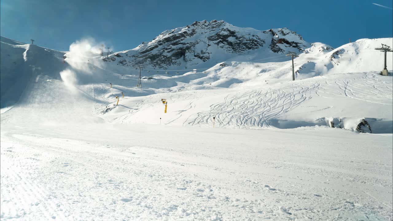 Skiing mountains of Austria with snow machines blowing, time lapse