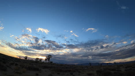 dynamic cloudscape of the harsh climate of the mojave desert landscape - wide angle time lapse