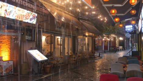 rainy night scene at street cafes