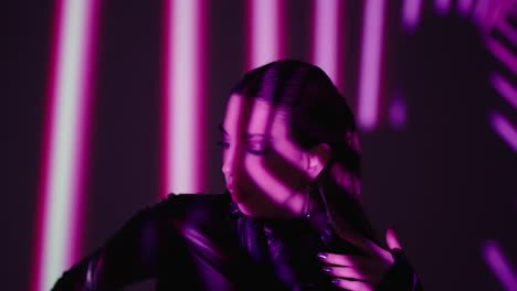 silhouette of a woman posing in pink and purple lighting