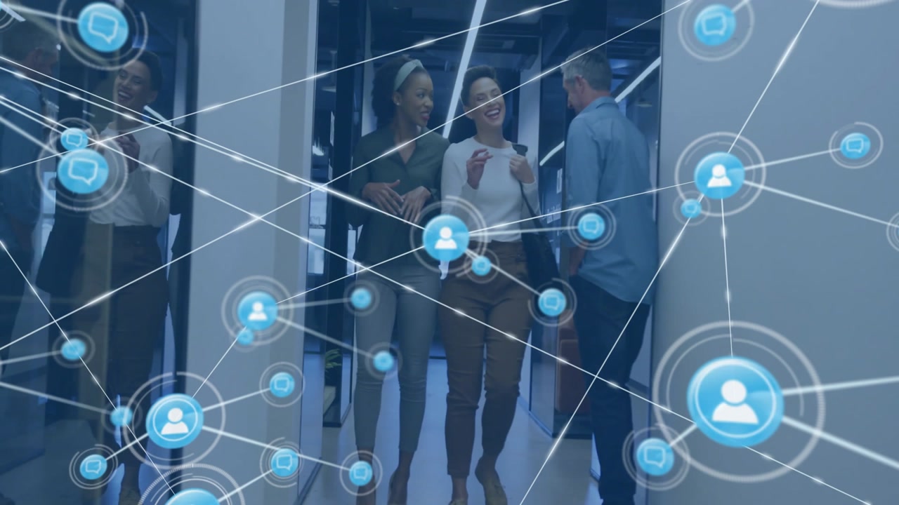 Corporate team walking through office hallway, showcasing digital network connection icons overhead