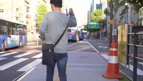 Man-Walking-Through-Downtown-Seoul