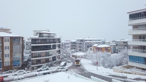 a slow, drone-like ascent captures a snowy day in denizli, turkey