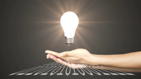 holding glowing light bulb over binary code, symbolizing innovation and technology