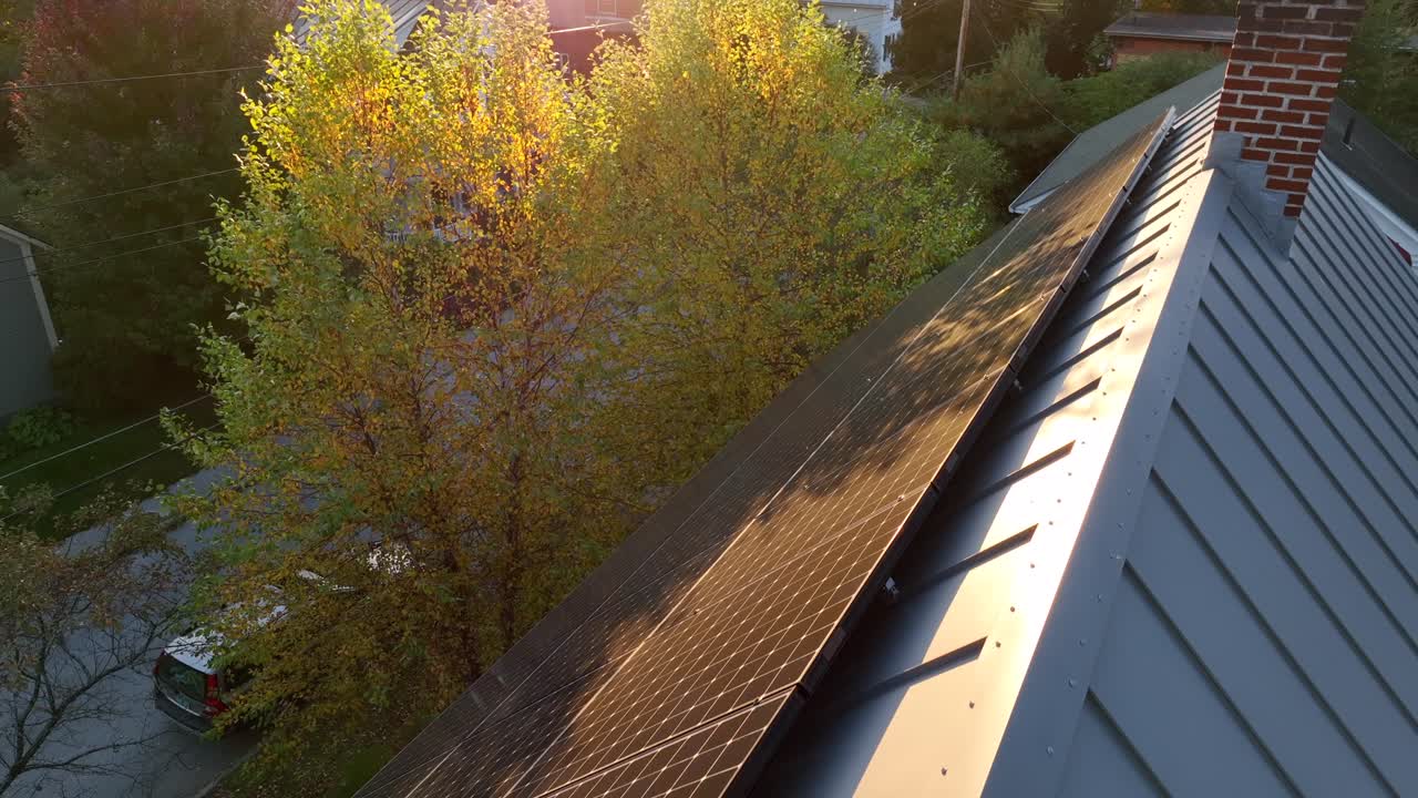 Metal roof with solar panel array Sunlight reflection