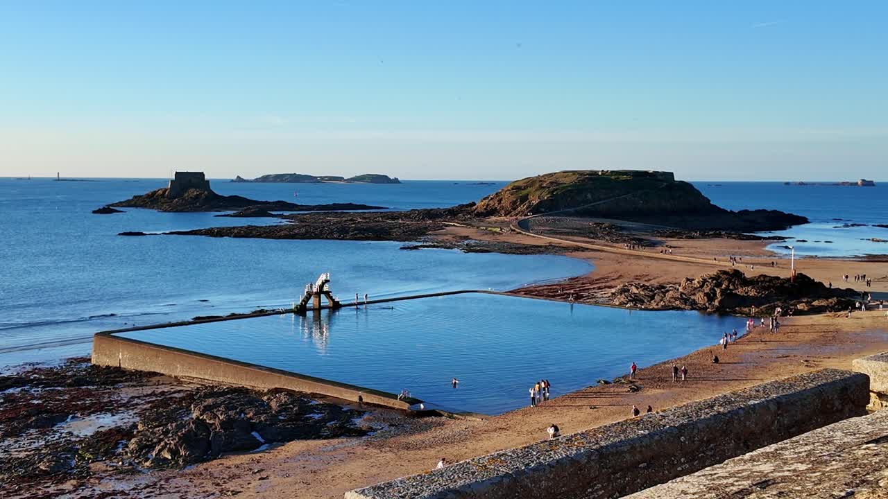 Panorama view about the Grand Bé and Petit Bé and seawater swimming pool at Bon-Secours beach, Saint-Malo, France.