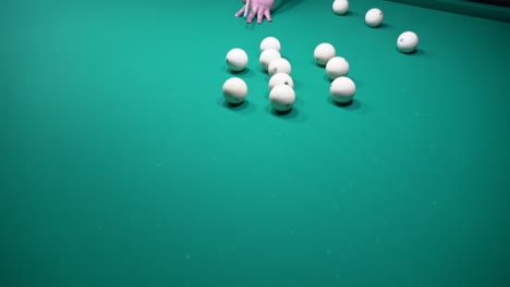 a sports game of billiards, pool or snooker on a billiard table with a green cloth.hitting billiard balls with a cue. cue kick.participate in games and competitions,score a goal in the pocket in match