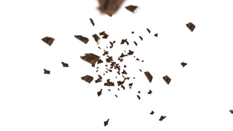volando muchas piezas de chocolate en fondo negro. alimentos y dulces. leche y oscuro. animación de bucle 3d de chocolate girando.