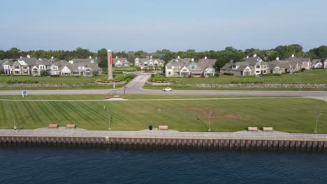 Riverwalk,-navigation-tower,-and-houses-along-the-St-Clair-River-in-Port-Huron,-Michigan,-USA