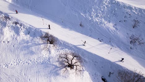 Skiers-on-platter-lift-in-Norway