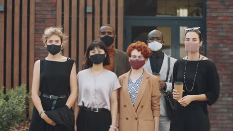 portrait of multiethnic business people in masks on street