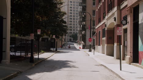 urban alley scene with people and parking signs