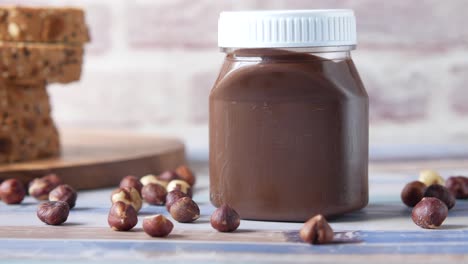 chocolate hazelnut spread with bread and hazelnuts