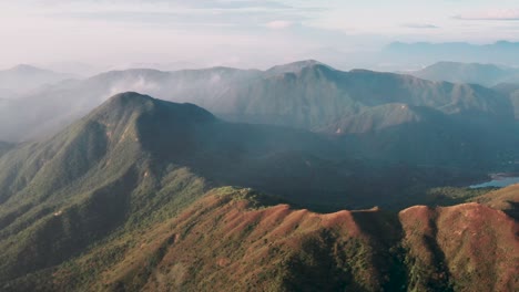 Aerial-pan-across-Sai-Kung-mountains-illuminated-by-sun-in-Hong-Kong