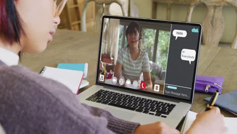 Composition-of-asian-schoolgirl-on-laptop-online-learning-with-biracial-schoolgirl