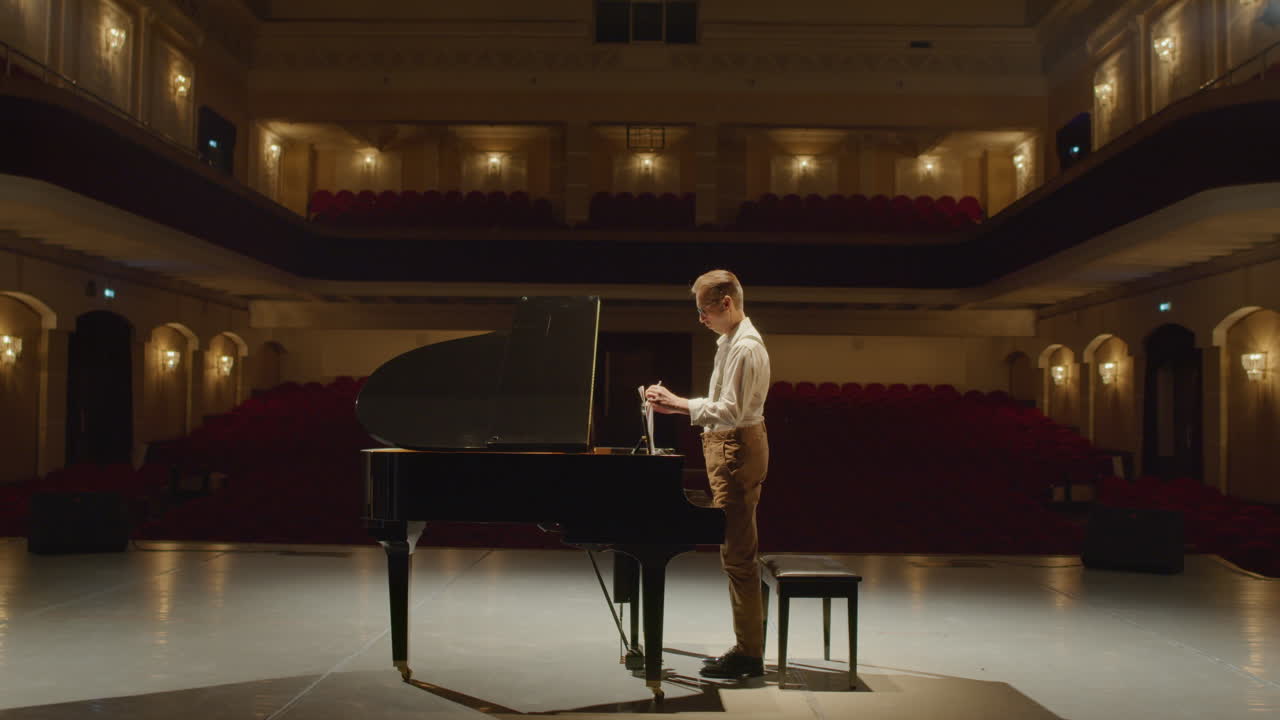 Pianist Walking on Stage and Playing Piano
